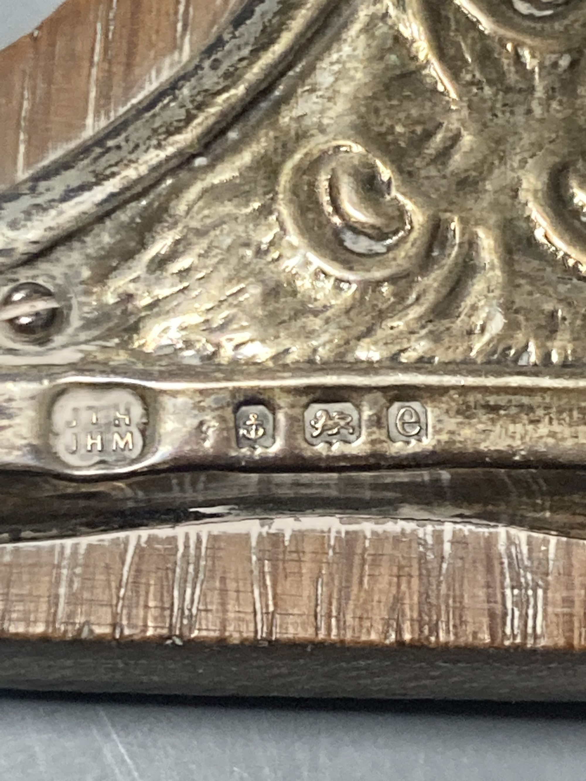 Two Art Nouveau silver-mounted wooden easel photograph frames by Hukin & Heath,